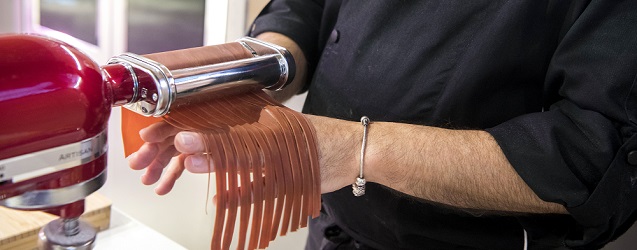 A taste of Italy: Italian Chef Daniele Paralovo preparing fresh pasta out of KitchenAid stand mixer.